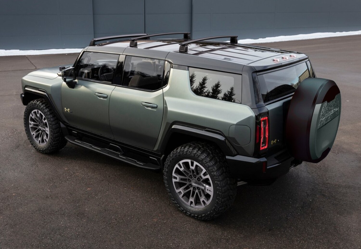 Rear aerial exterior view of the 2024 GMC Hummer EV SUV