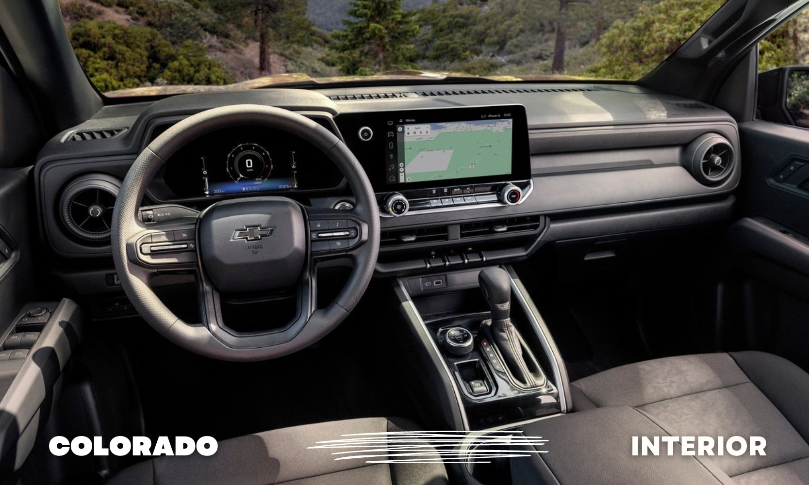 Used%20Chevy%20Colorado%20Trucks%20Best%20Interior%20-%20Octane%20GMC%20of%20Santa%20Fe.jpg Front dashboard and cabin inside a used 2023 Chevy Colorado truck