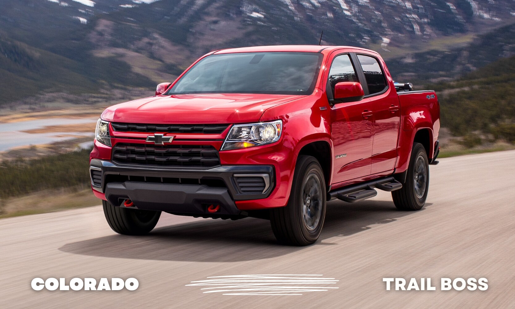 Best%20Used%20Chevy%20Colorado%20Trail%20Boss%20Trucks%20-%20Octane%20GMC%20of%20Santa%20Fe.jpg a red used Chevy Colorado Trail Boss truck driving down an open road through the mountains