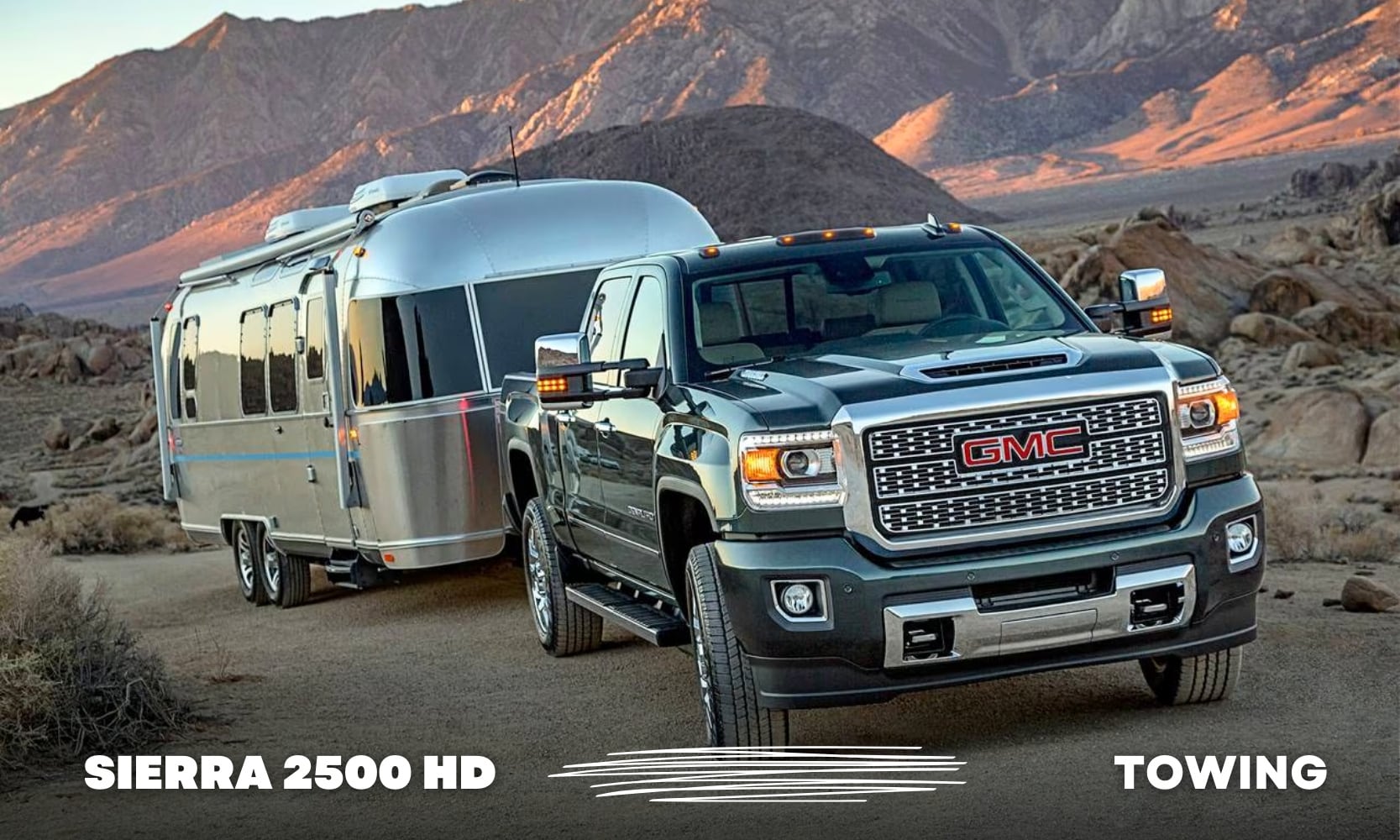 photo of a 2018 GMC Sierra HD Denali Truck towing a large camper up a mountain