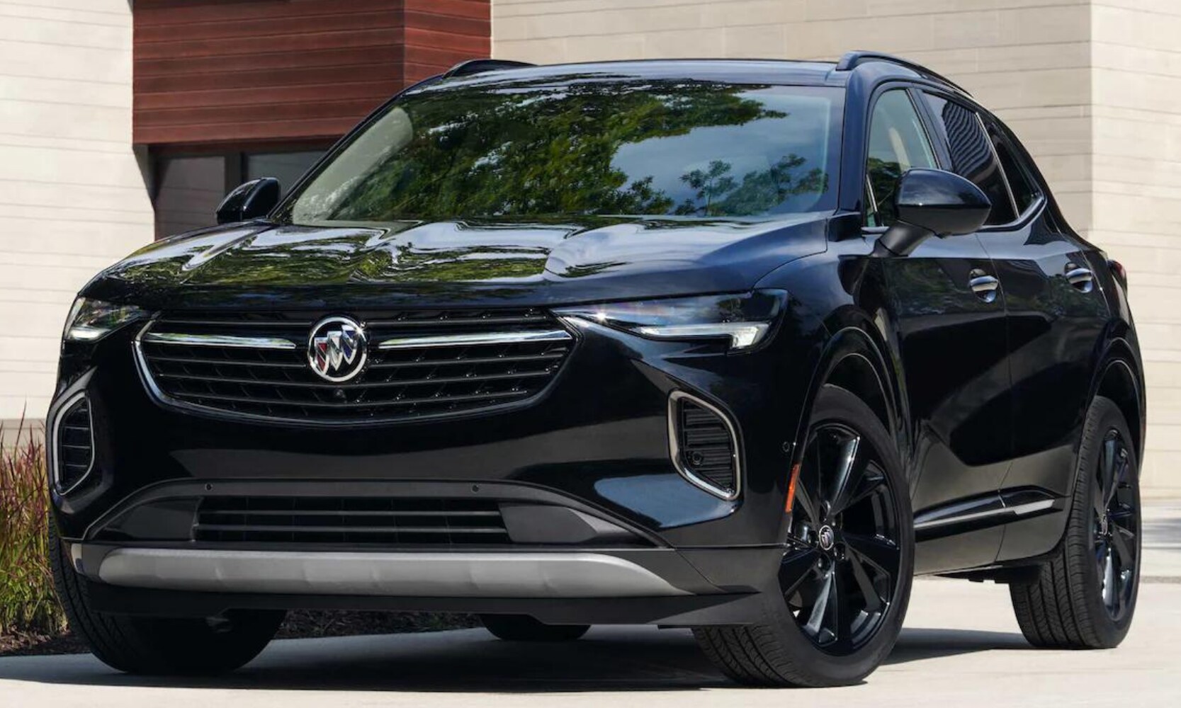 2022 Buick Envision Exterior Comparison - Octane Buick GMC of Santa Fe.png Exterior view of a black 2022 Buick Envision SUV