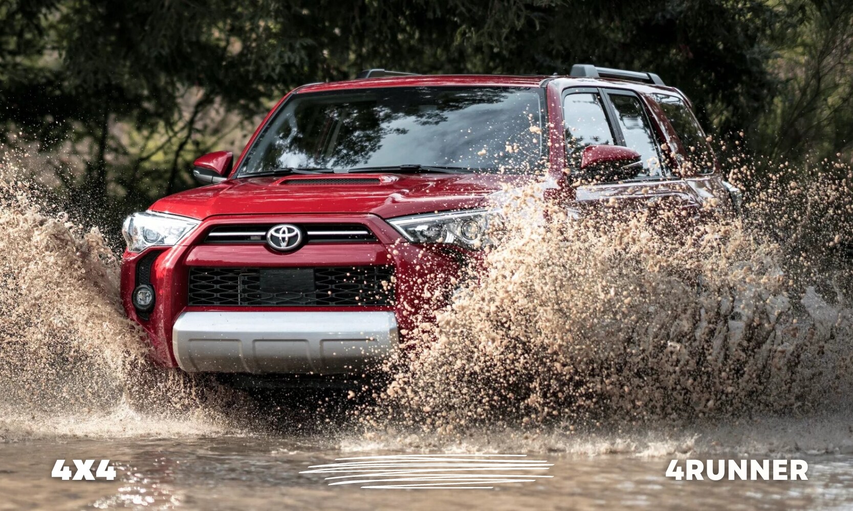 a red used Toyota 4Runner SUV going off-road and making a big splash in a large dirty puddle