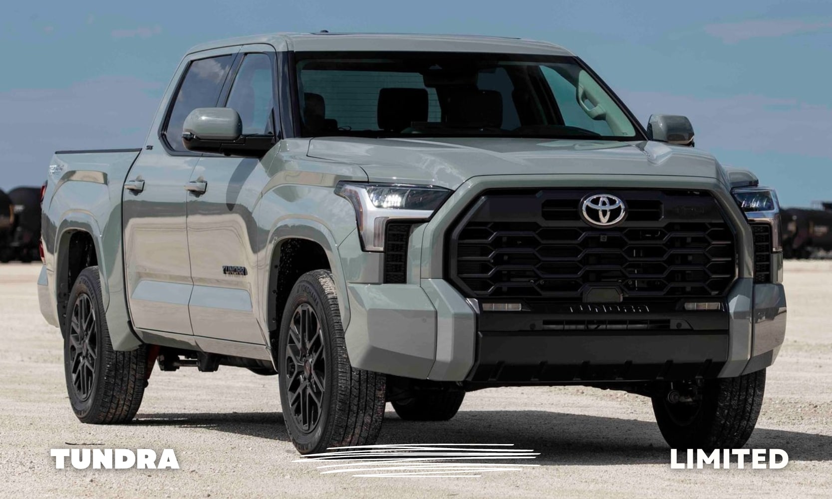 Front passenger side view of a green used Toyota Tundra Limited truck driving toward the camera lens