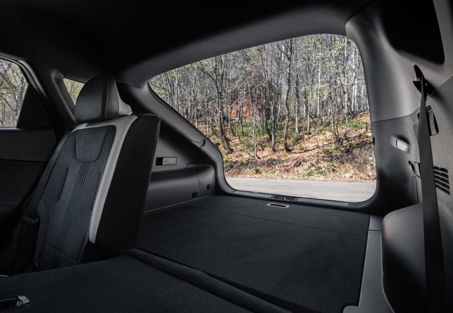 2023 Kia EV6 Cargo Space Comparison showing the rear cargo area with the seats folded down