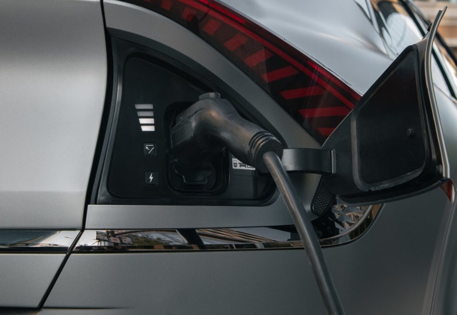 Close up view of a charging cable plugged into a 2023 Kia EV6