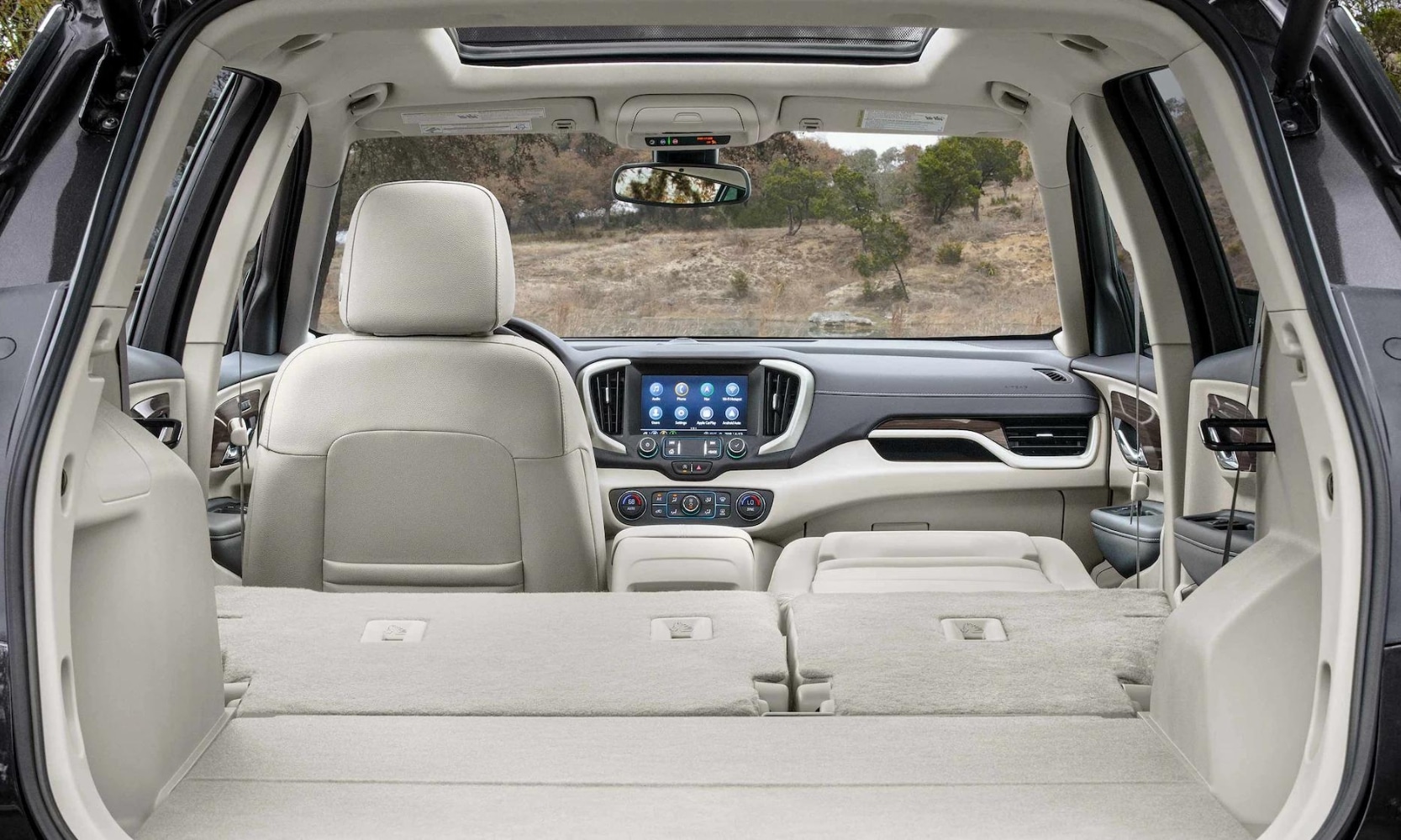 Rear cargo space area with all seats folded down inside the 2023 GMC Terrain Denali