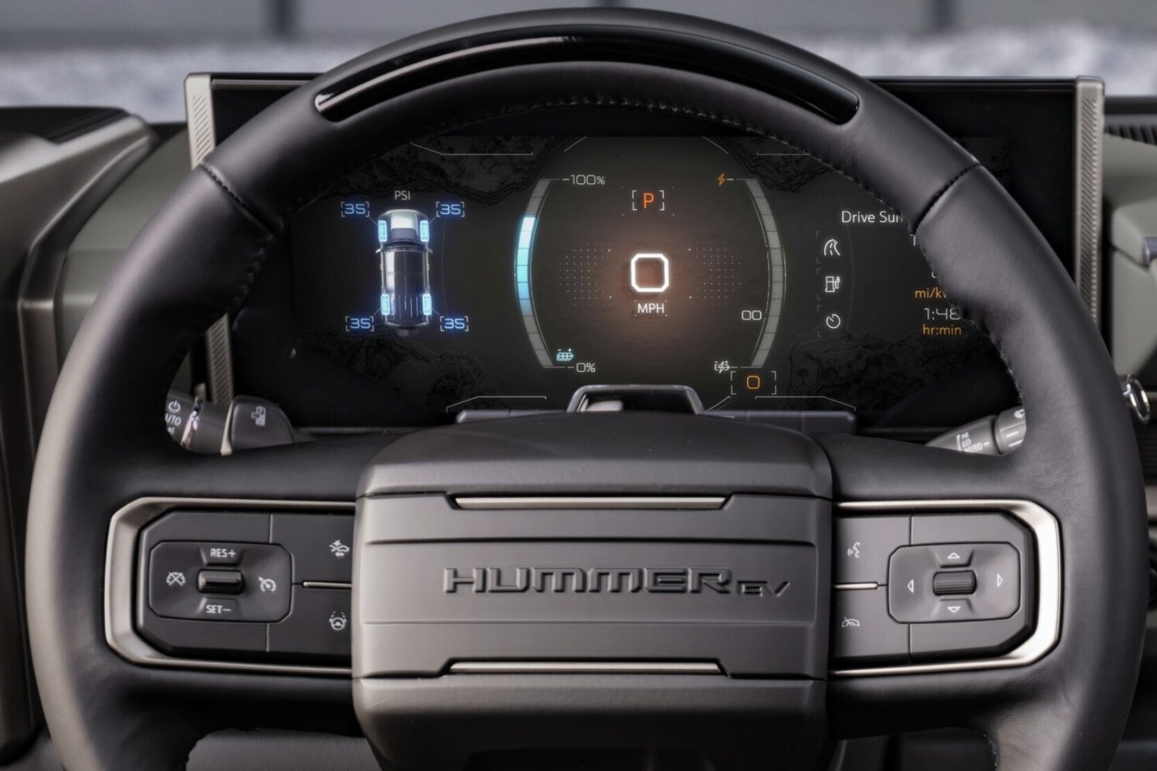 Close up view of the instrument panel showing the Regen On Demand feature display behind the steering wheel of the 2024 GMC Hummer EV Pickup Truck