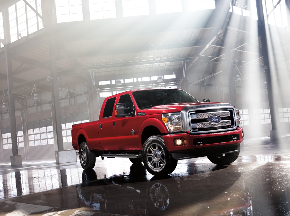 2016-Model-Images-Ford-Super-Duty-F450-Platinum-Truck-L01.png red Ford F-450 truck parked at a construction site
