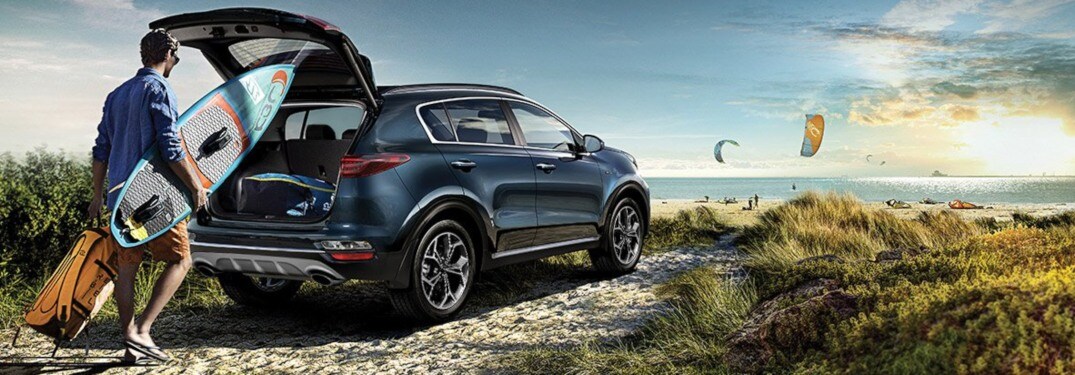 2020-Kia-Sportage-blue-back-view-loaded-with-surfboards_o.jpg