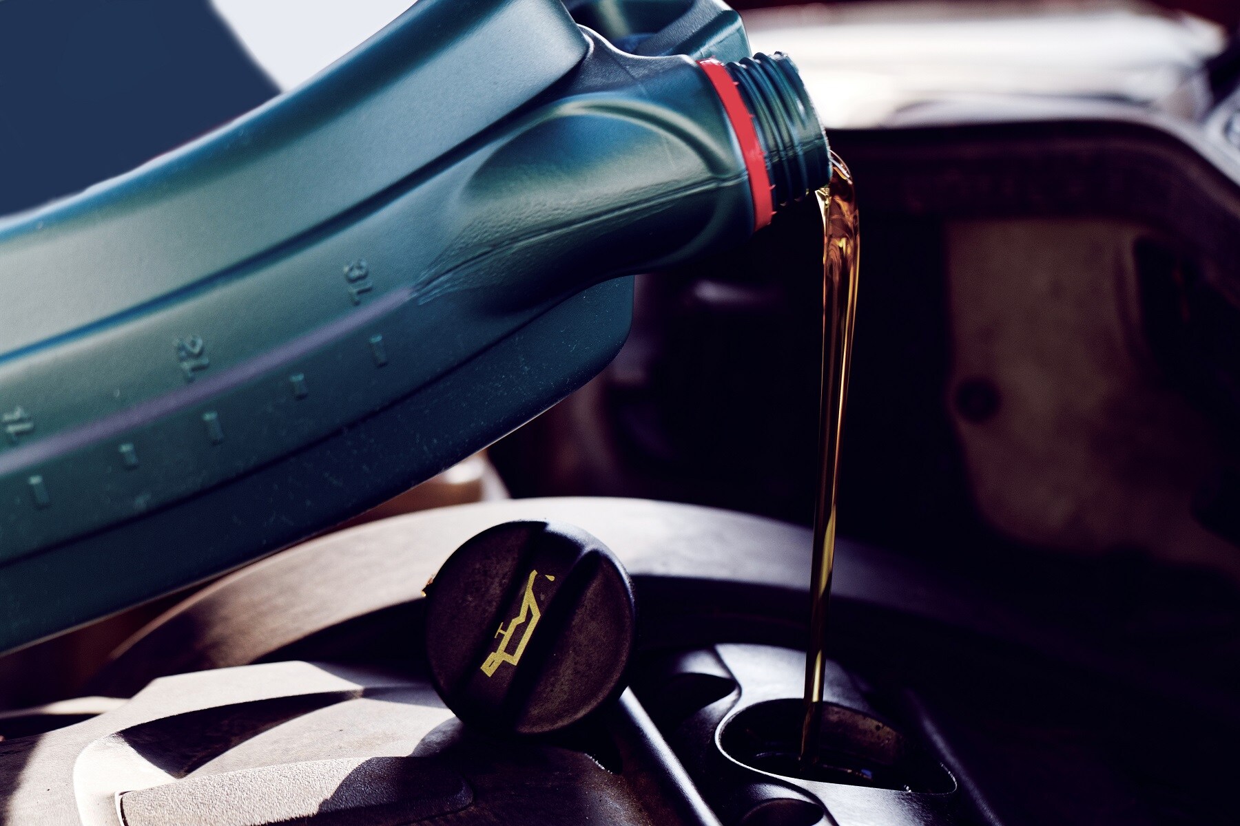 Pouring Oil Into Car