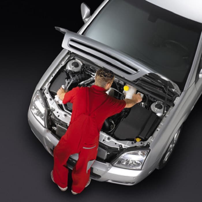 Top_View_of_Mechanic_Working_On_Car.jpg