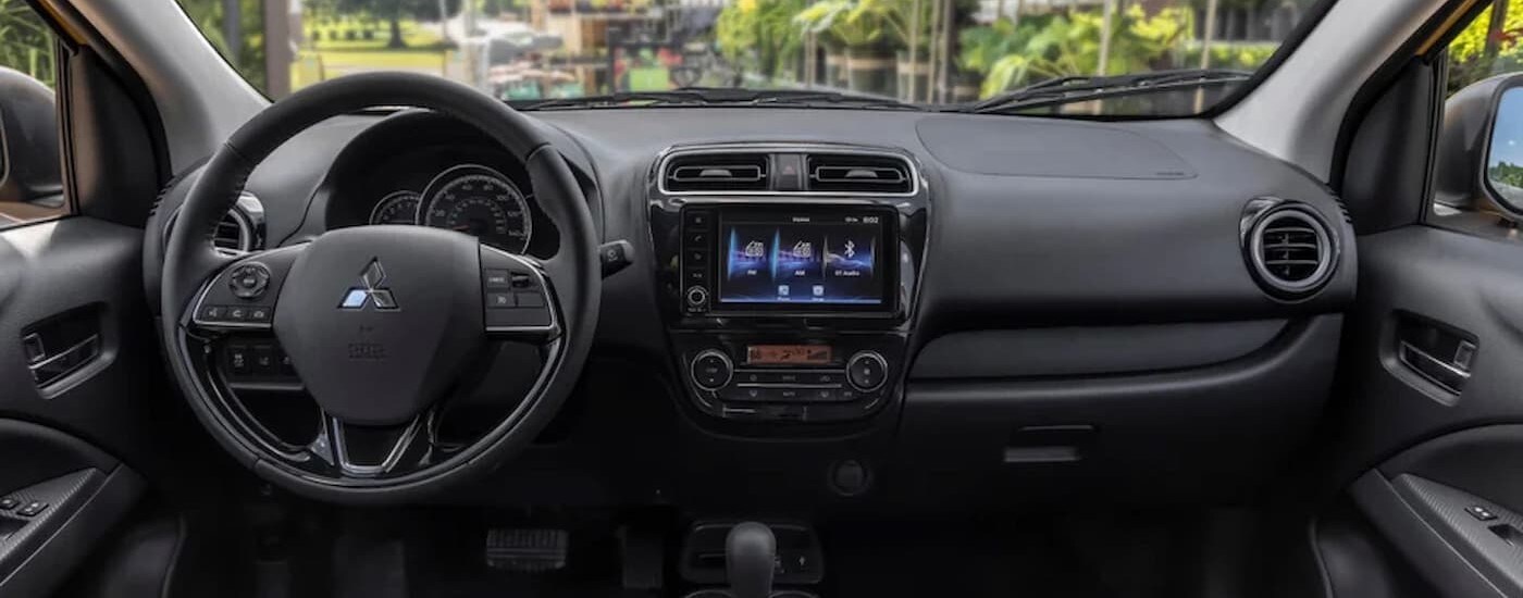2024 Mitsubishi Mirage - Interior.jpg The black interior and dash of a 2024 Mitsubishi Mirage is shown.