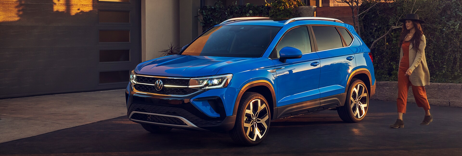 Performance features of the 2022 Taos at West Broad Volkswagen of Richmond | 2022 Taos sitting at modern home in shade