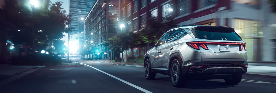 Compare the 2022 Hyundai Tucson vs. the 2021 Honda CR-V at West Broad Hyundai | Tucson speeding in downtown at night