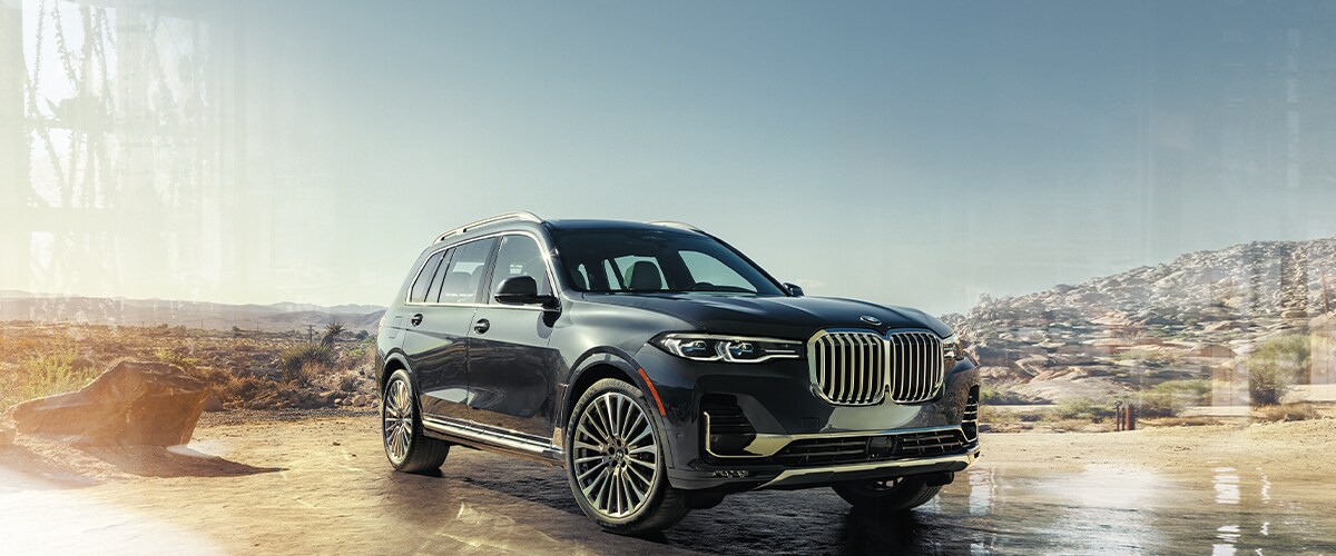 Black BMW X& parked in desert