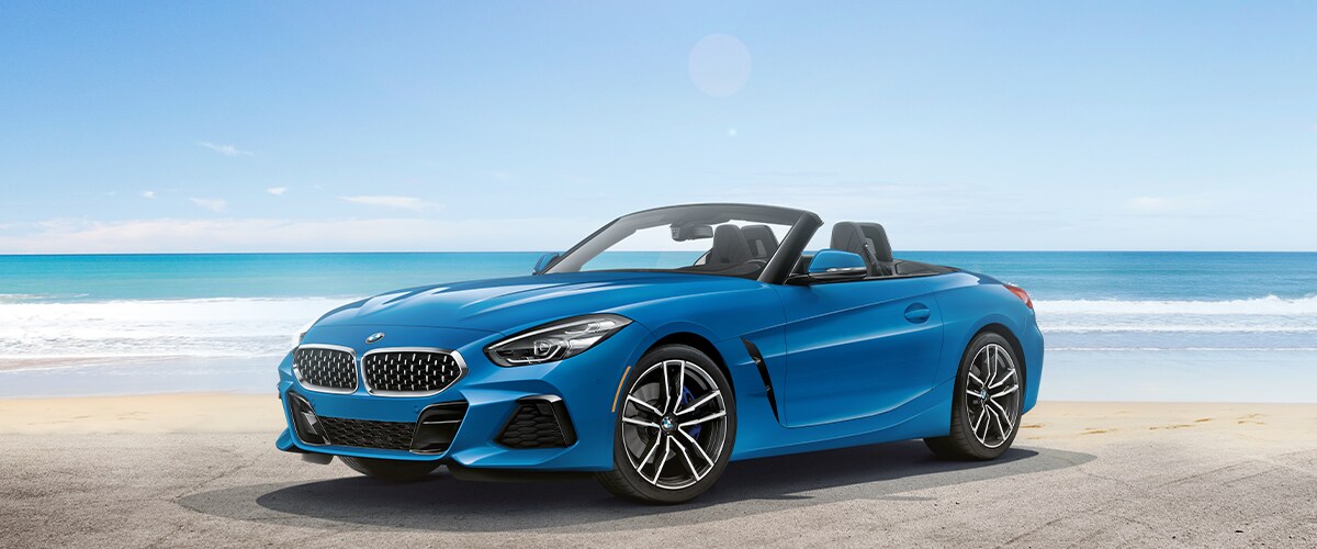 Light Blue BMW Z4 parked on beach