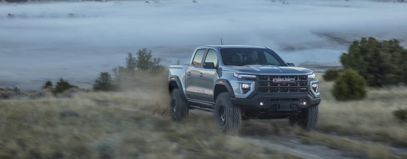 A grey 2025 GMC Canyon from the front at an angle after leaving one of the GMC dealers near Spring Hill.