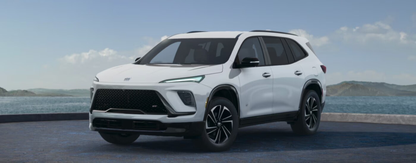 2026%20Buick%20Enclave%20-%20ST.png White 2026 Buick Enclave ST parked at an angle