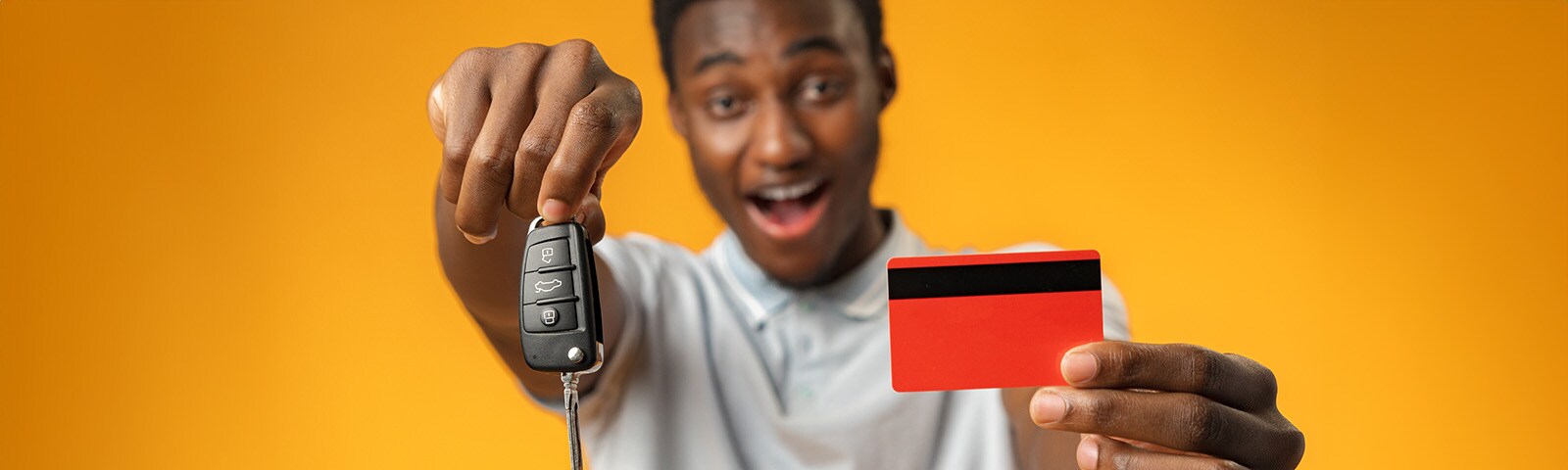african-man-showing-car-key-and-credit-card-over-y-2023-11-27-05-33-29-utc.jpg