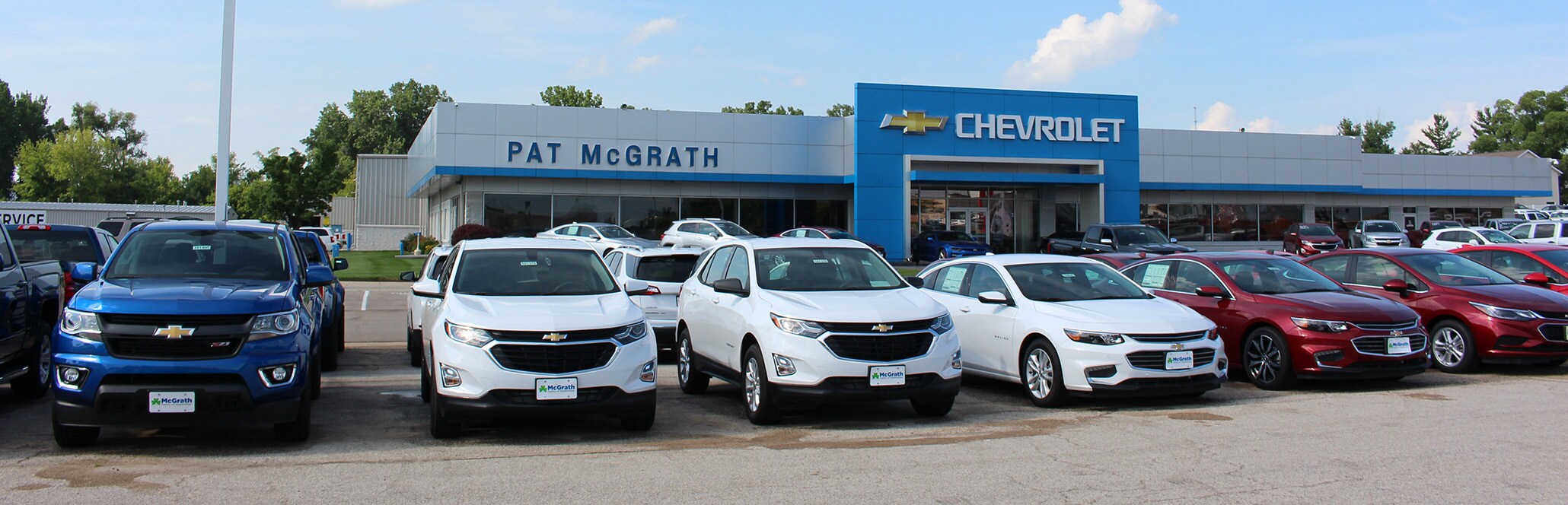 Chevy Dealer Near Me Chevyland storefront with Chevy vehicles parked out front