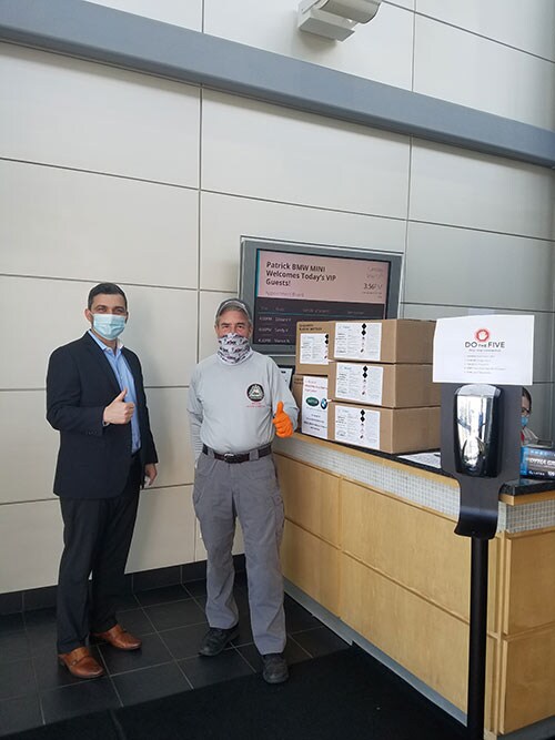 Patrick BMW delivery to Bill Bennet President of Woodfield Area Childrens Organization