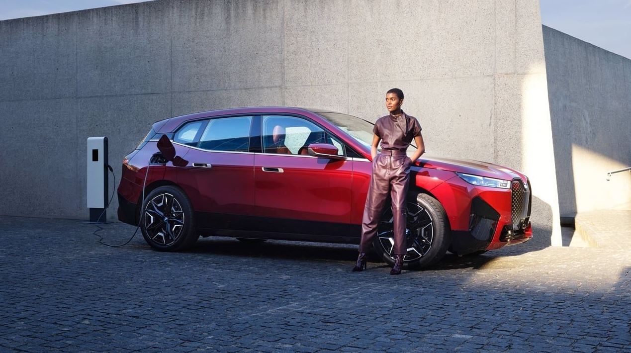 2022-bmw-ix-charging-with-woman.JPG