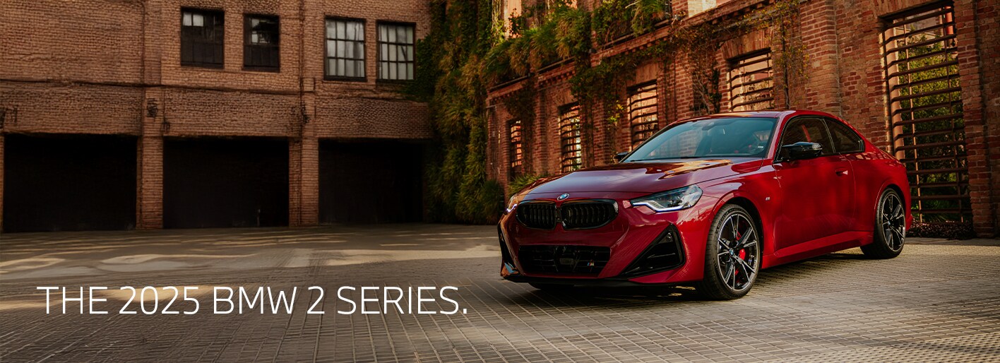 A dynamic and sleek 2025 BMW 2 Series Coupe in motion, showcasing its modern design, bold lines, and athletic stance. The image highlights the coupe's powerful presence, with sharp features, stylish wheels, and a distinct BMW front grille.