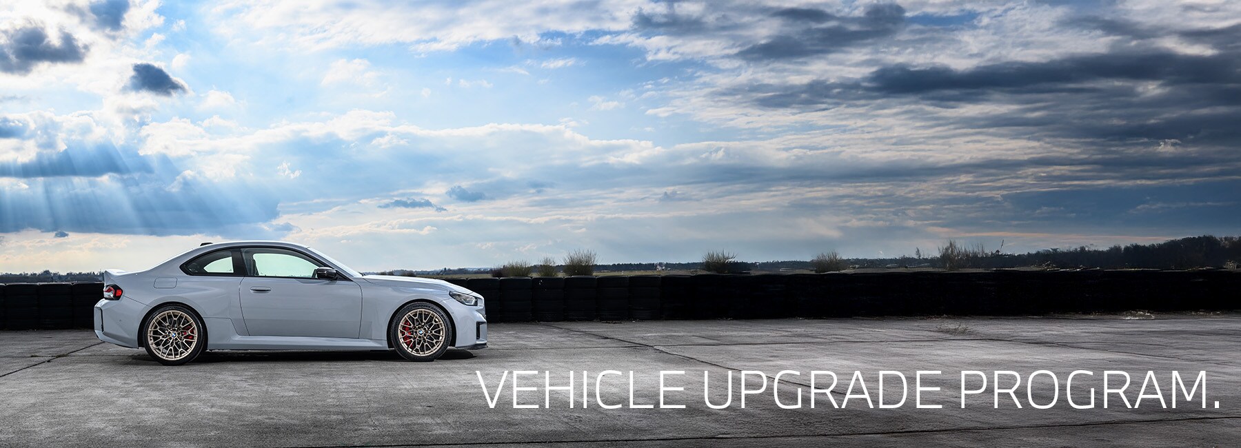 BMW Vehicle Upgrade Program banner featuring luxury BMW models and special upgrade offers at Patrick BMW in Schaumburg, IL.