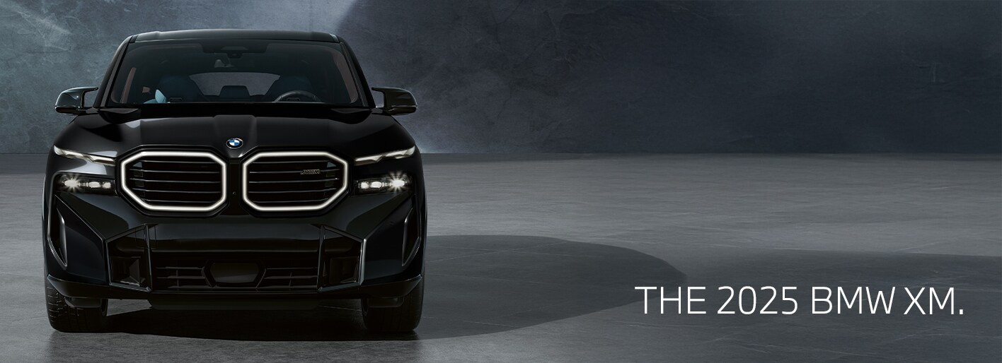 Bold and powerful 2025 BMW XM plug-in hybrid SUV with iconic illuminated kidney grille and dynamic M design.