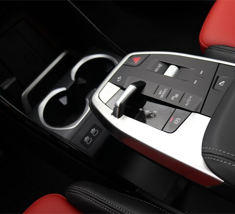 Close-up of the 2026 BMW X1 center console featuring the modern gear shifter and control buttons.