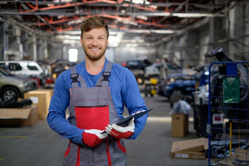 body-shop-repair-man-similing-holding-clipboard.jpg