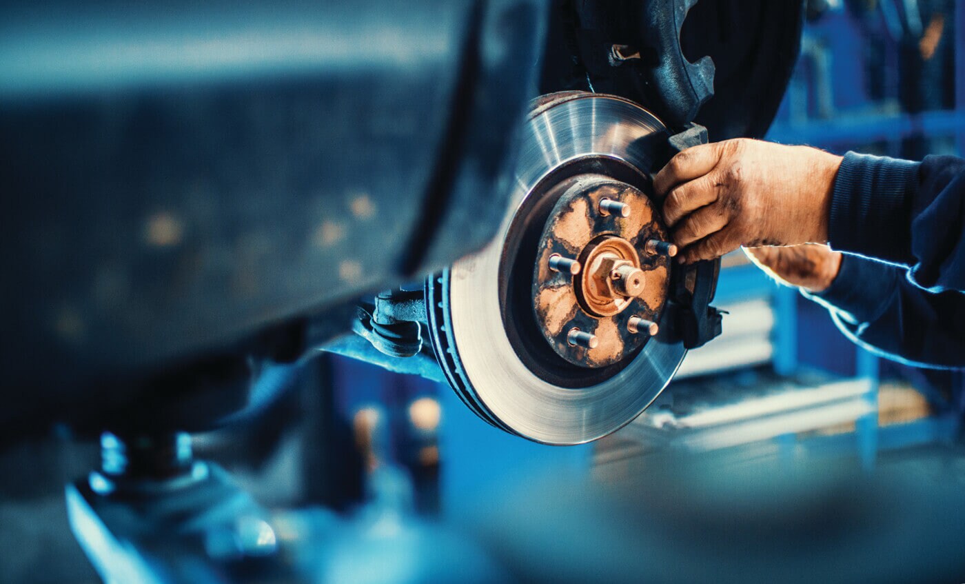 Man changing brakes on a car