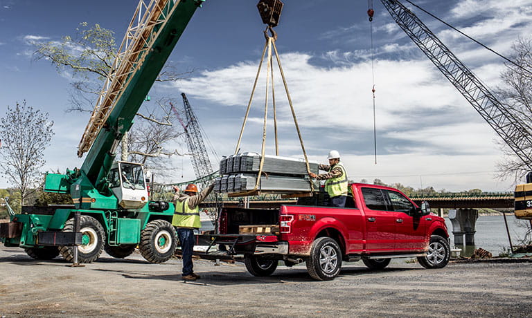 2019 Ford F-150 2019 Ford F-150 side view with construction workers