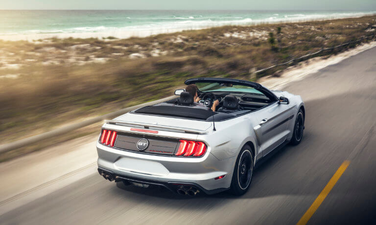 2019 Ford Mustang driving by the coast
