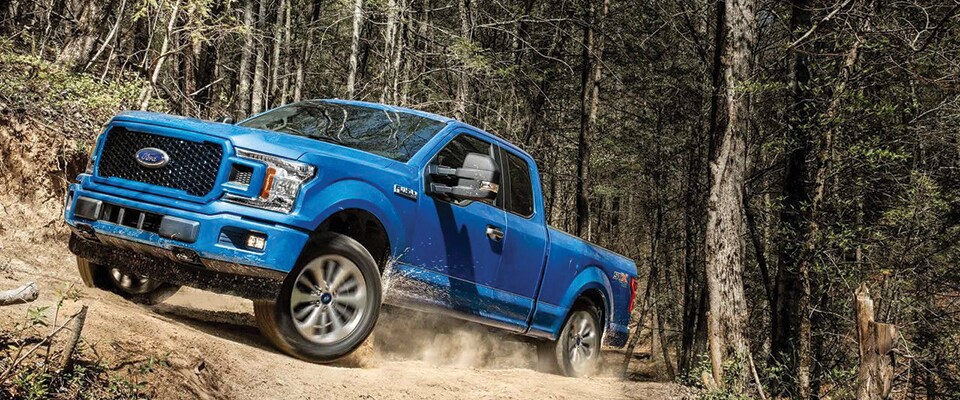 2018 Ford F-150 STX driving on a rocky road
