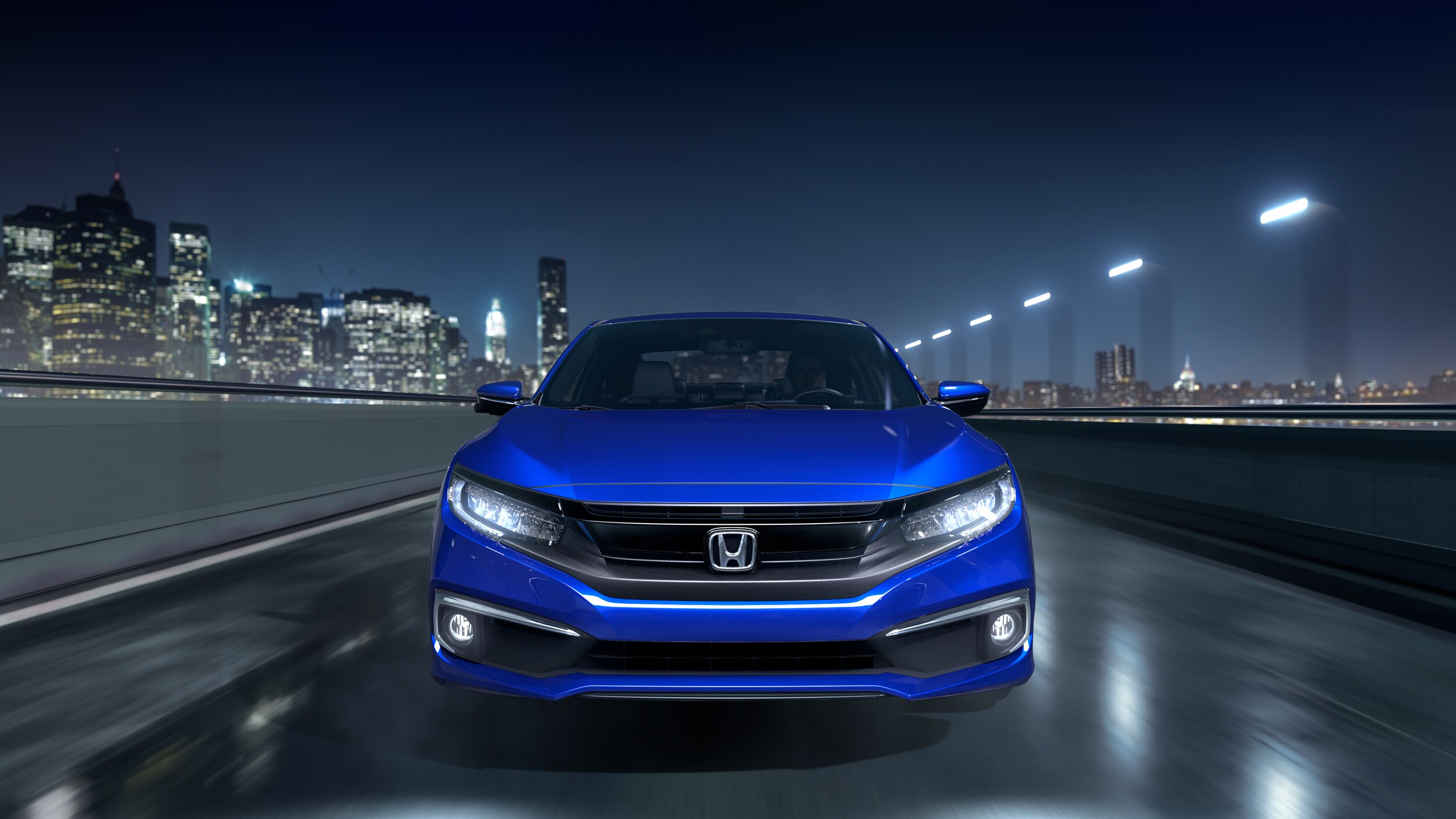 2020 Honda Civic blue front view cityscape .png