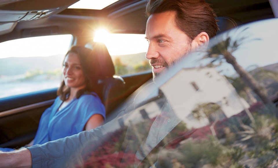 Toyota-Lifestyle- man and woman driving with window down.jpeg