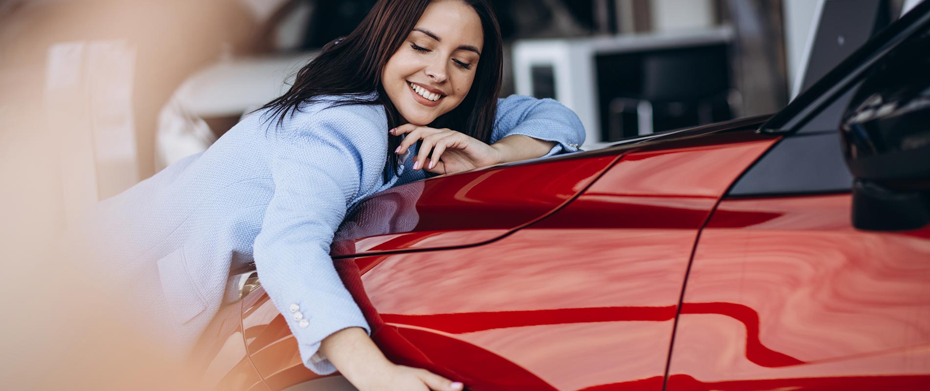 Why Buy Used Ford Smiling woman hugging the hood of her used Ford
