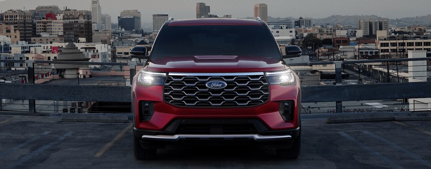 Ford%20Dealer%20Near%20Springfield%202025%20Ford%20Explorer%20-%20Front%20Parked.jpg Red 2025 Ford Explorer parked on city rooftop lot