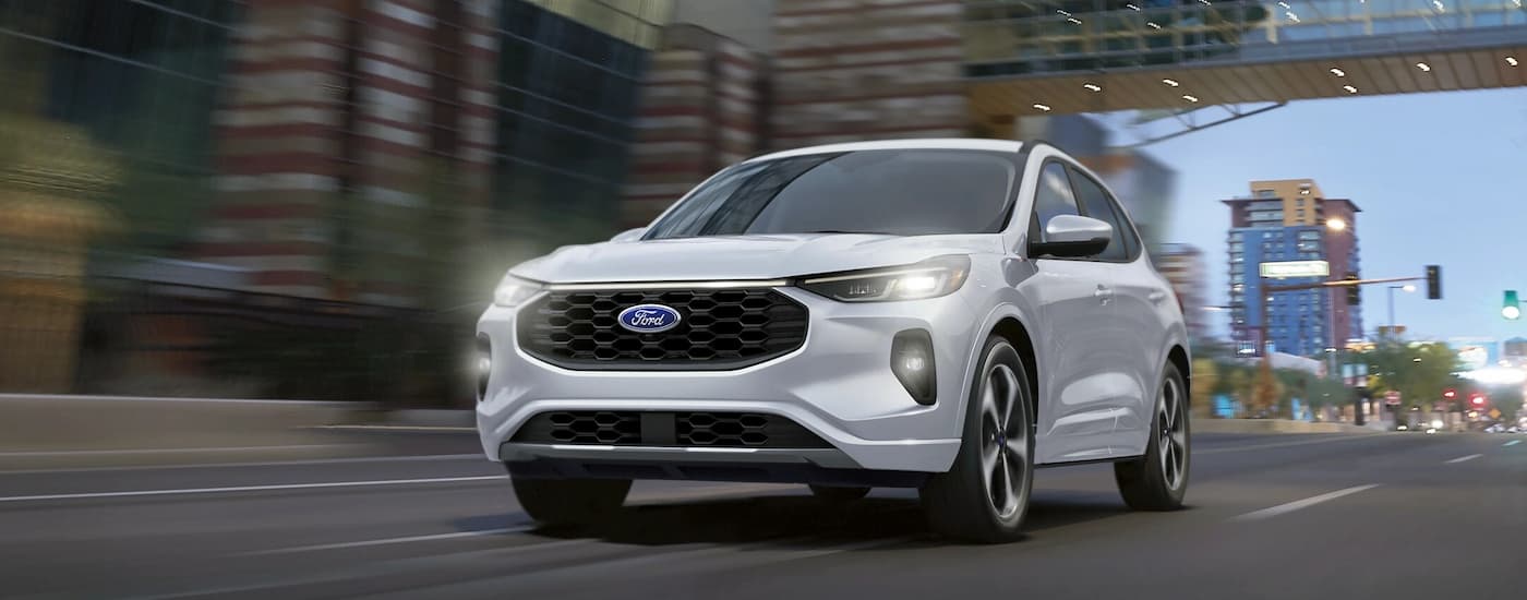 Used Ford for Sale Near Springfield 2025 Ford Escape White City (1).jpg White 2025 Ford Escape driving on a city street