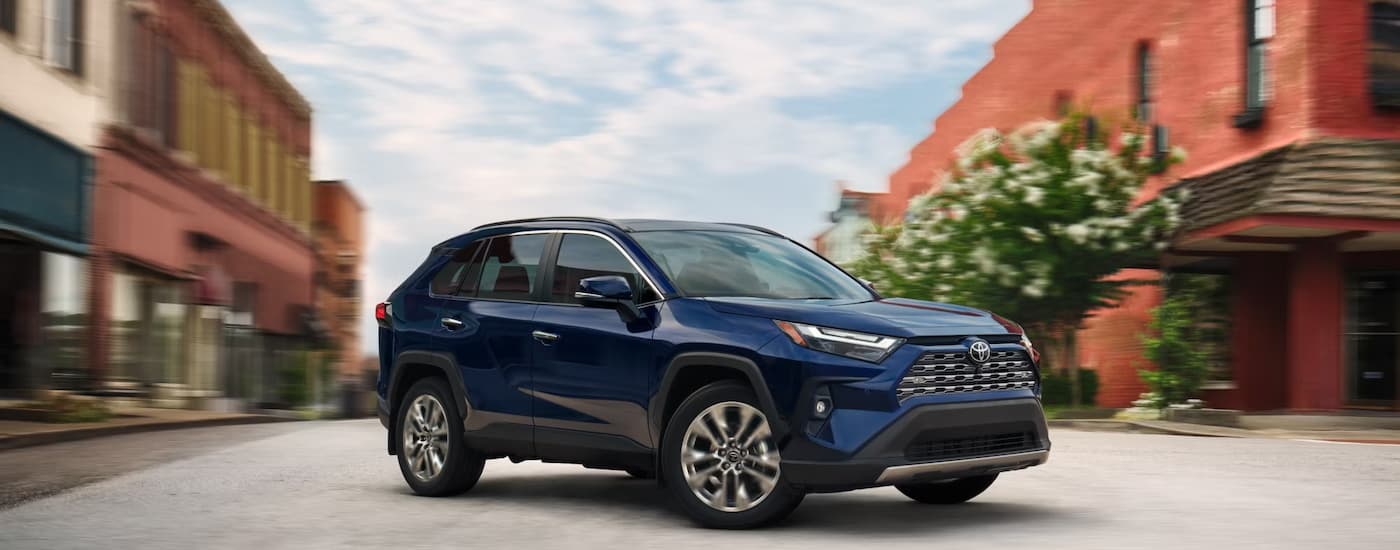 wlp%20-%202025%20Toyota%20RAV4%20for%20sale%20-%20Blue.jpg A blue 2025 Toyota RAV4 parked in a city