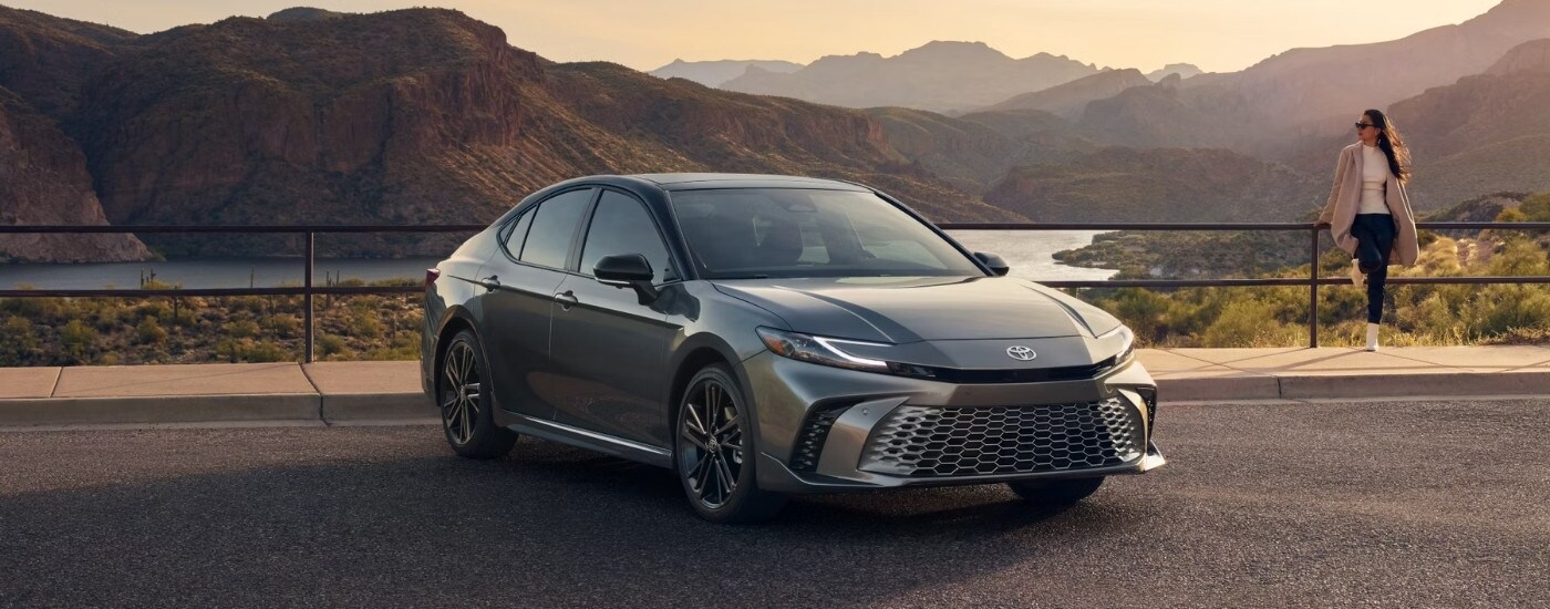 A grey 2025 Toyota Camry from the front at an angle.