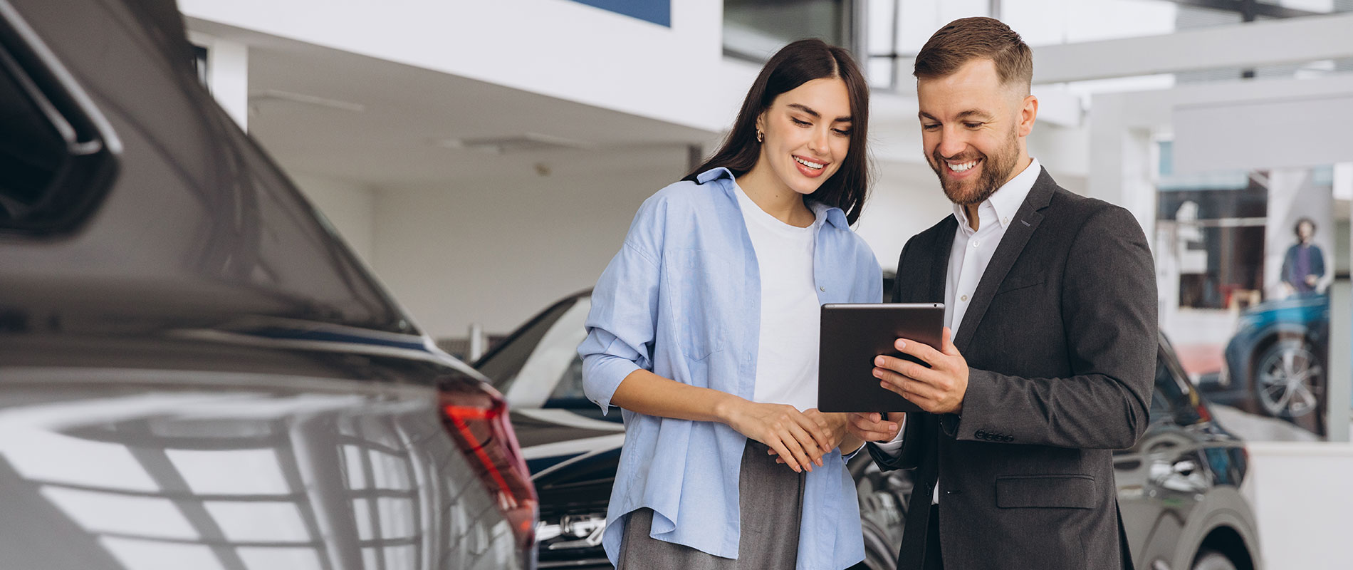 Why Buy Used Vehicle Woman smiling hearing about her ideal used Toyota model