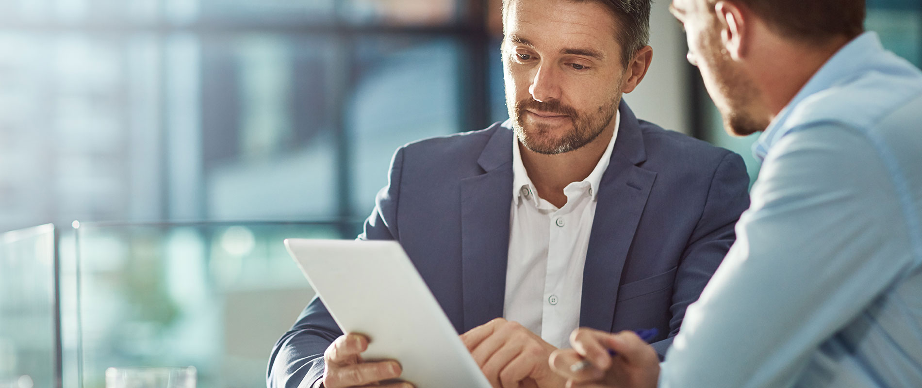 Why Finance With Peoria Toyota? Financing professional discusses options with a customer