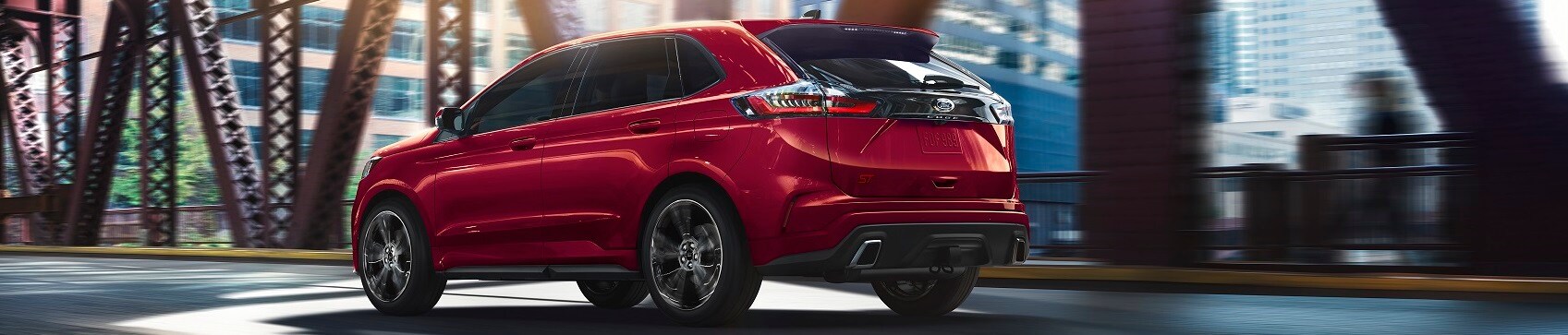 Ford Dealer Peru IN Ford Edge driving over city bridge