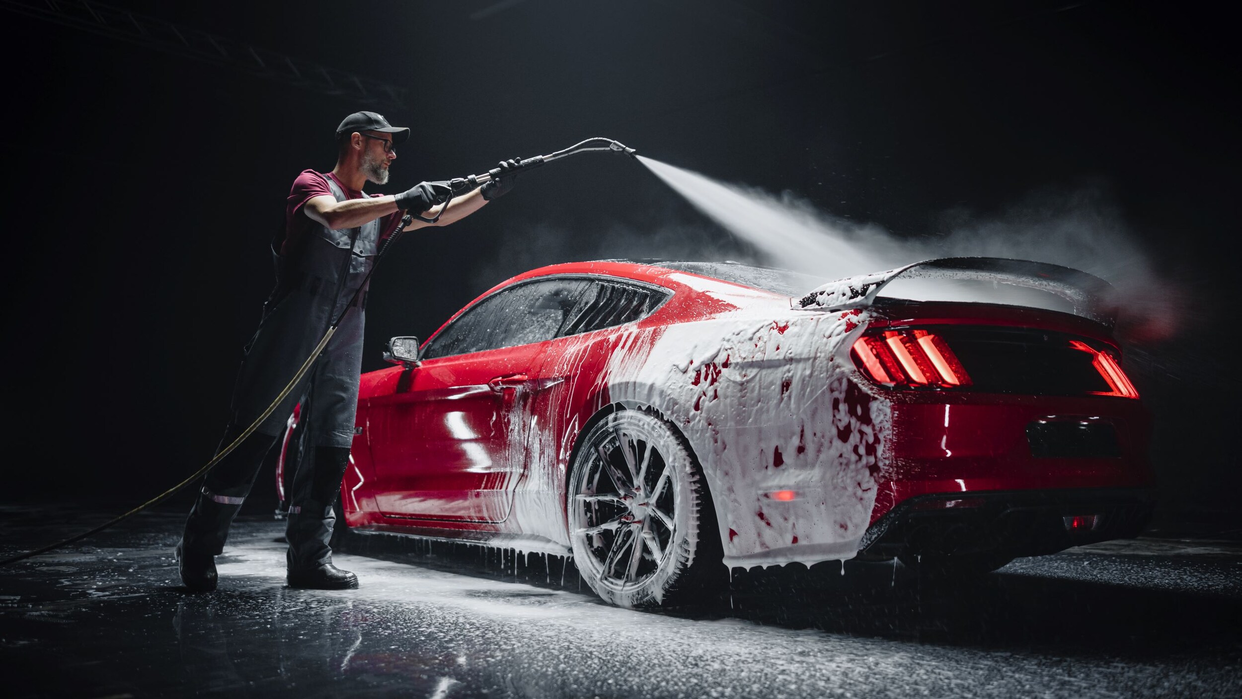 AdobeStock_598537978.jpeg A Ford Mustang being washed.