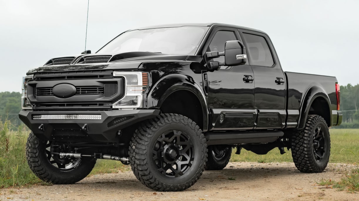 2022 Ford F150 Black Ops-2.PNG A view of the 2022 Ford F150 Black ops as it sits parked on a sunny day near a river, with all black exterior, deep tinted windows, and matte black accents