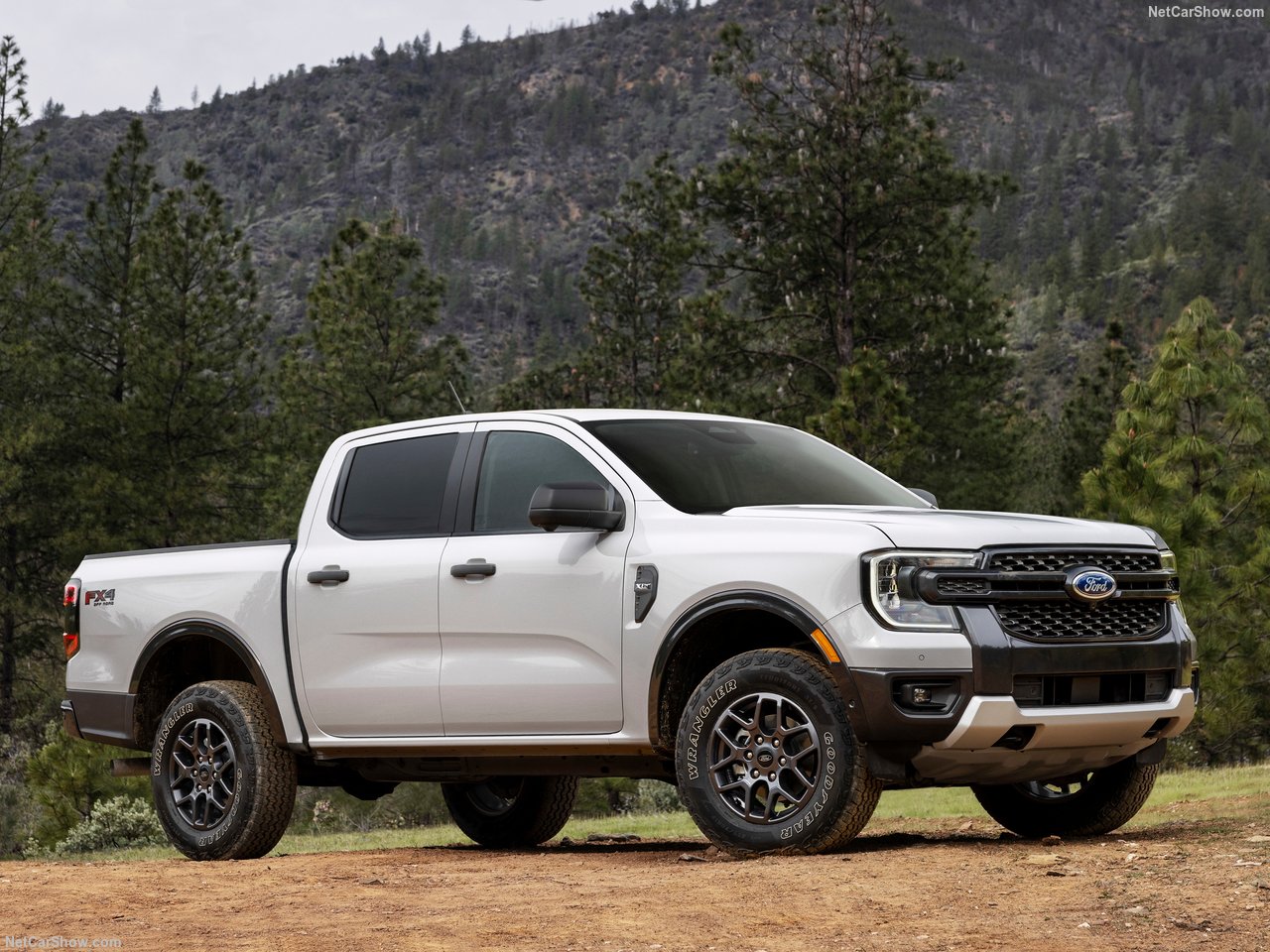 Ford-Ranger_US-Version-2024-1280-01.jpg A Ford Ranger driving through a mountain road.