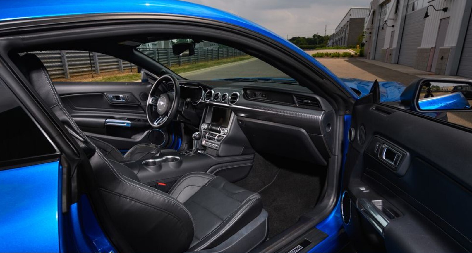 2021-ford-mustang-mach-1-03.jpg Interior view of the dark dashboard of a 2021 Ford Mustang Mach-1