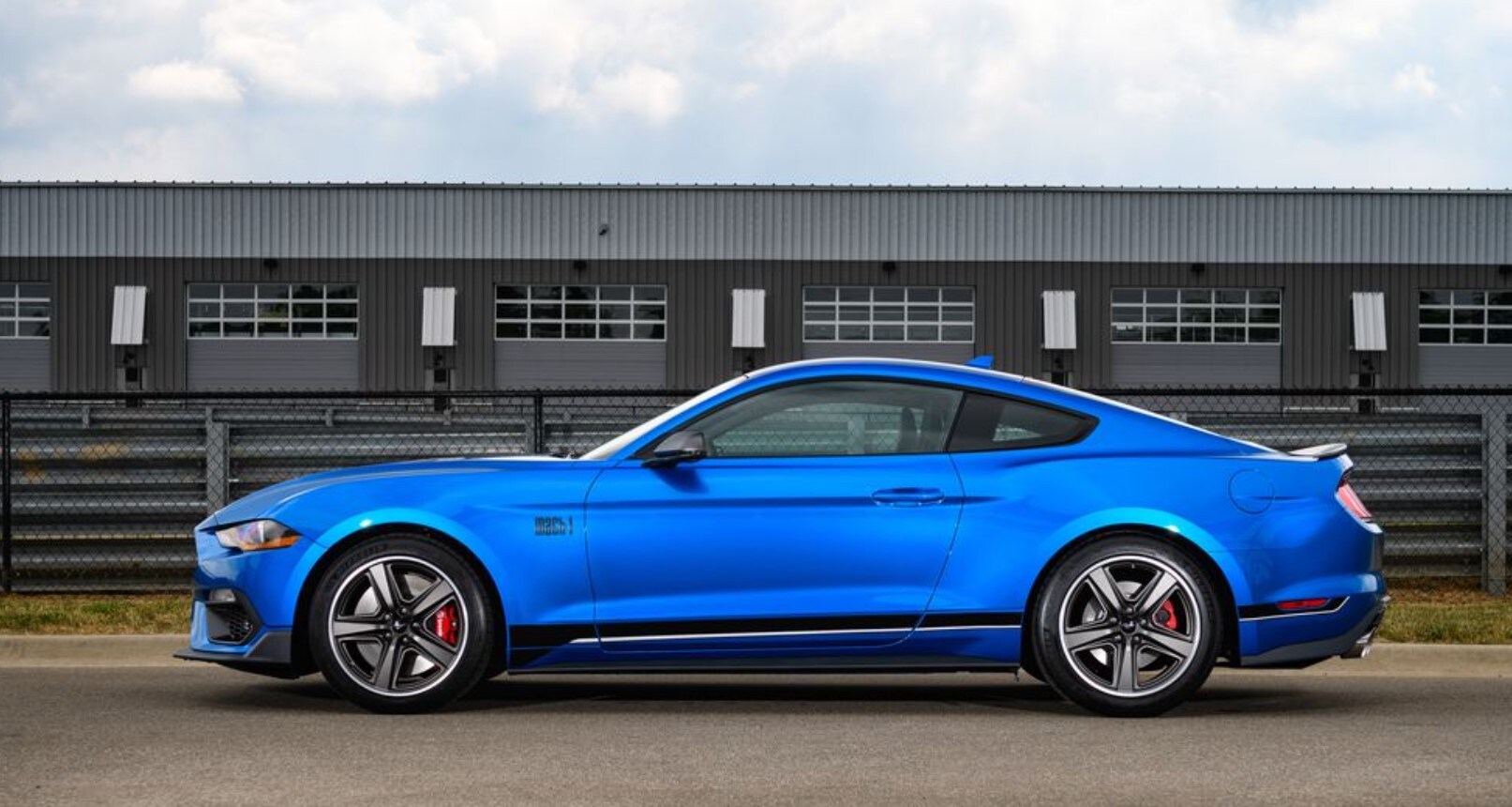 2021-ford-mustang-mach-1-10.jpg Profile view of a blue 2021 Ford Mustang Mach-1